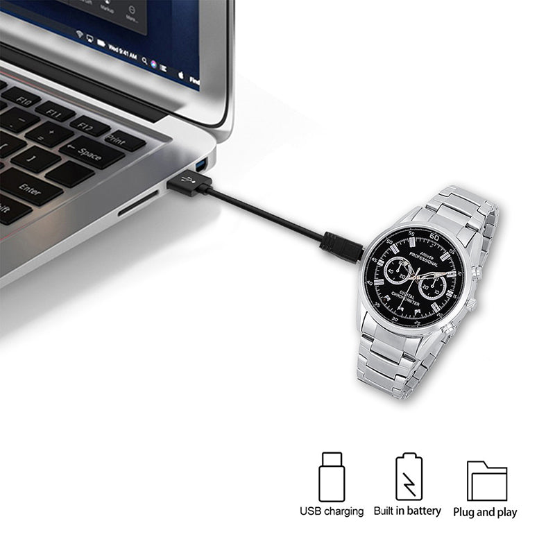 Silver watch with black dial connected to a laptop via USB cable, with charging icons below.