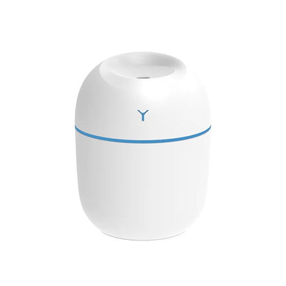 White cylindrical device with rounded top, blue accent line, and small black symbol on front.