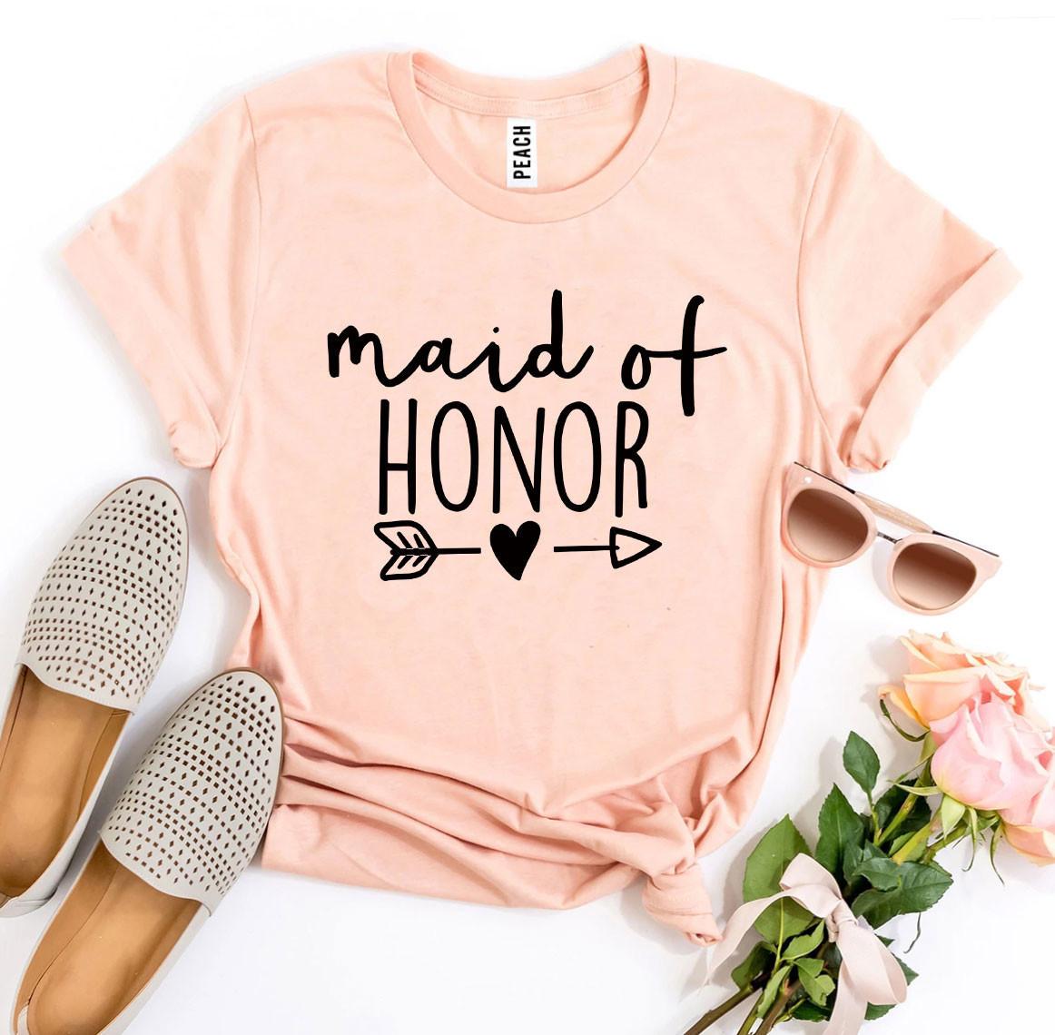 Peach "Maid of Honor" t-shirt with arrow and heart, paired with tan shoes, sunglasses, and roses.