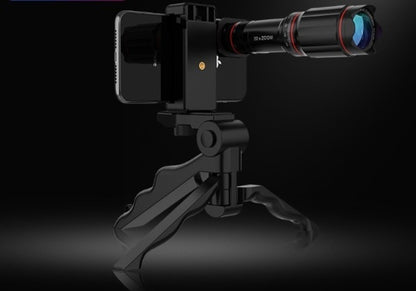 Smartphone with a zoom lens mounted on a black tripod, set against a dark background.