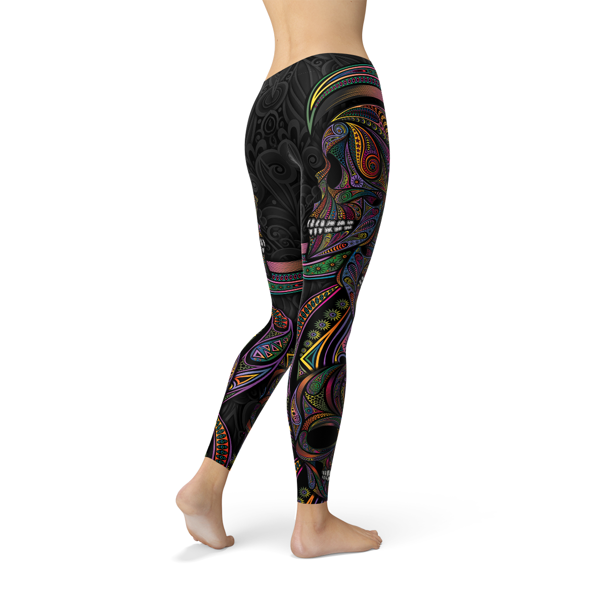 Colorful black leggings with intricate neon rainbow patterns and skull design, worn by a standing person.