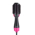 Black and pink oval hairbrush dryer with bristles and a curved handle.