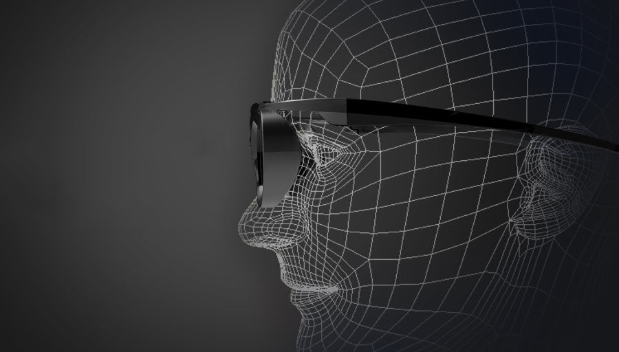 Wireframe head wearing sleek black sunglasses against a dark background, side profile view.