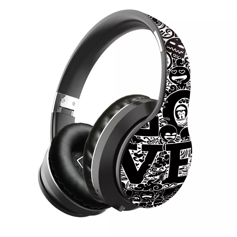 Black headphones with white graphic patterns and text on the band, featuring padded ear cushions.