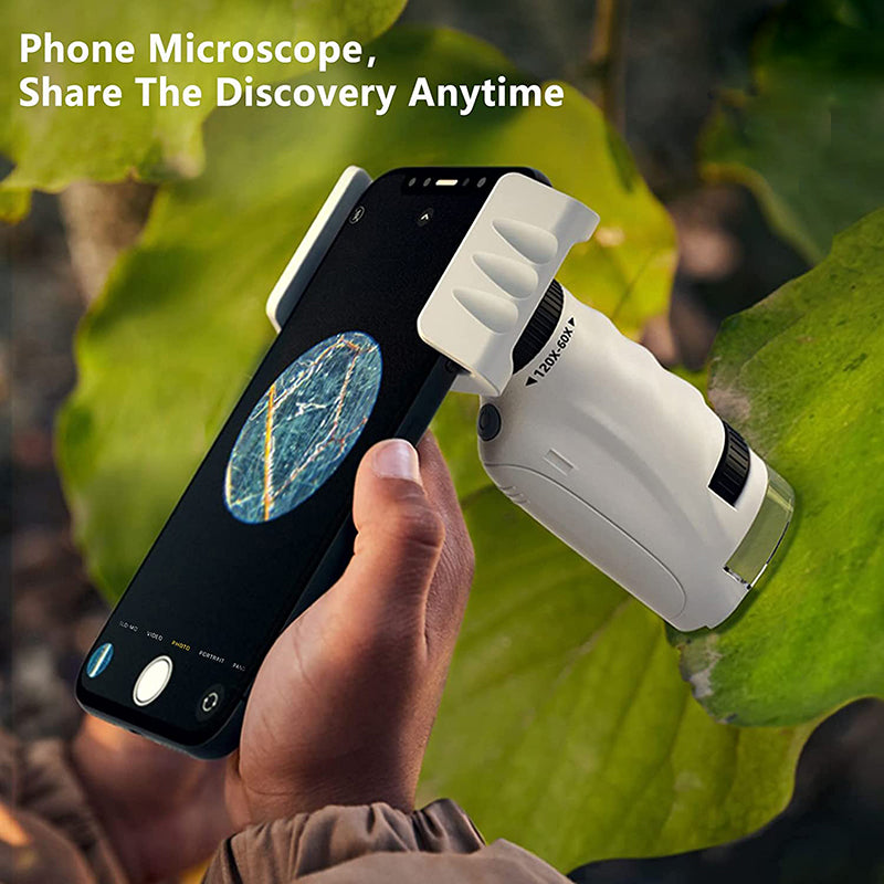 A white phone microscope attached to a phone capturing an image of a leaf.