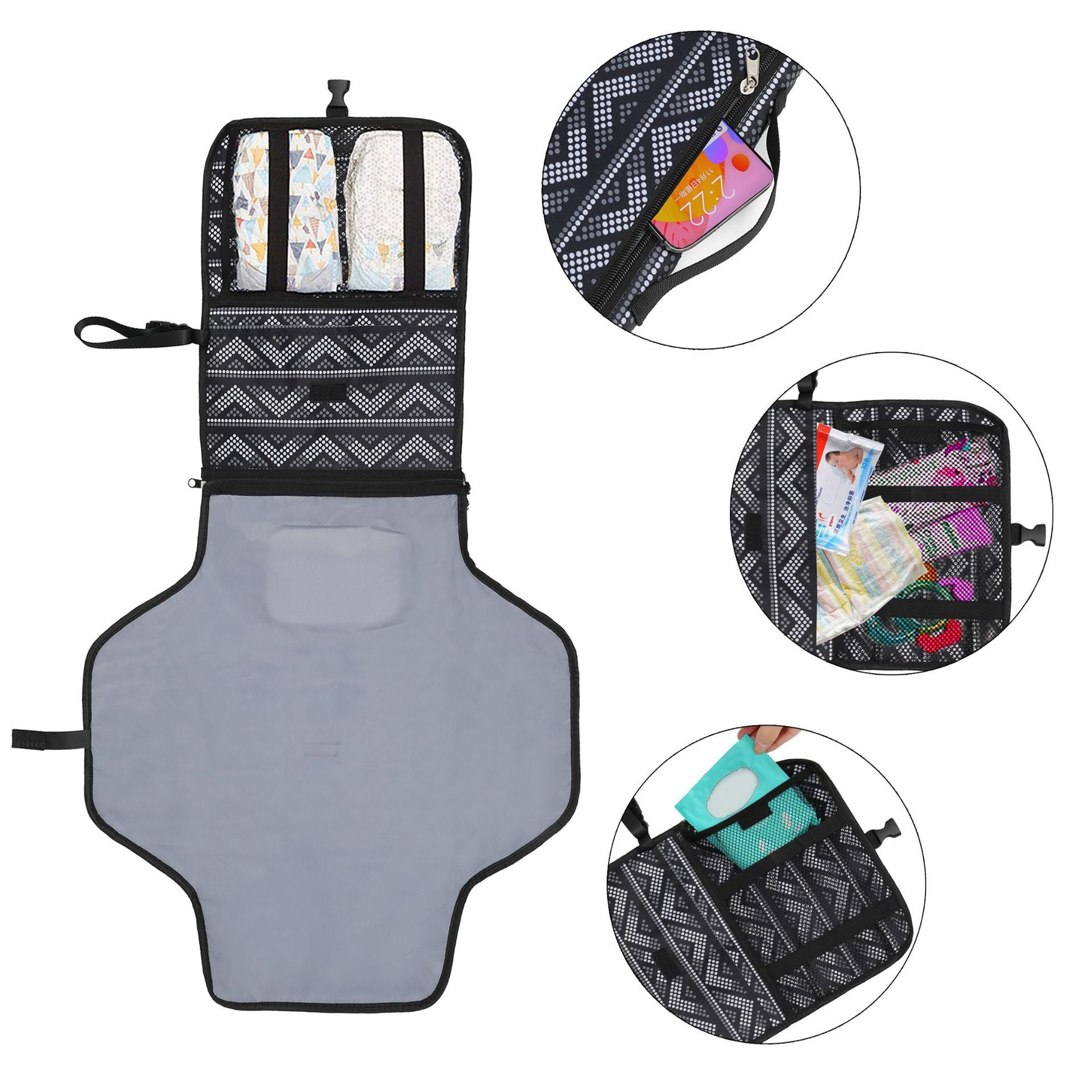 Foldable baby changing mat with black zigzag pattern, showing pockets with baby essentials.