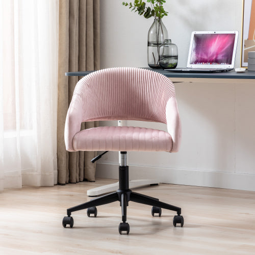 Pink ribbed office chair on wheels in a bright room, near a desk with a laptop and vase.