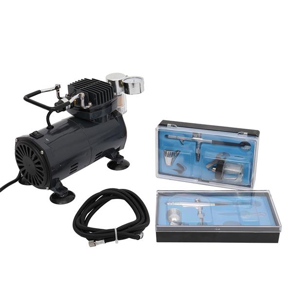 Black air compressor with hose and two clear cases containing metal airbrushing tools.
