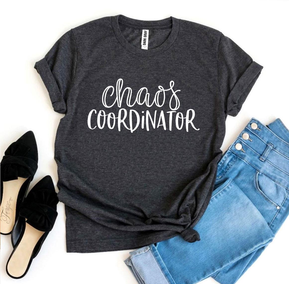 Dark gray T-shirt with "Chaos Coordinator" text, paired with blue jeans and black shoes.