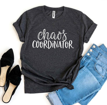 Dark gray T-shirt with "Chaos Coordinator" text, paired with blue jeans and black shoes.