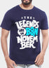 Man in a navy T-shirt with bold white and blue text saying "The Legends Are Born in November."