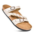 Beige sandal with braided straps, two metal buckles, cork footbed, and black sole.