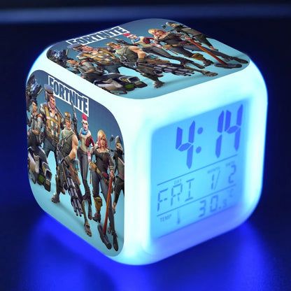 Glowing blue cube clock with Fortnite characters on sides, displaying time 4:14 and date info.
