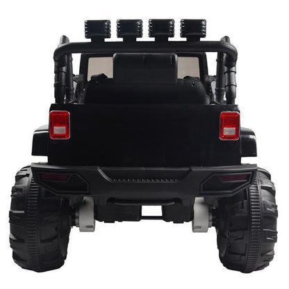 Black toy truck rear view with large wheels, roll bar, red taillights, and four top lights.