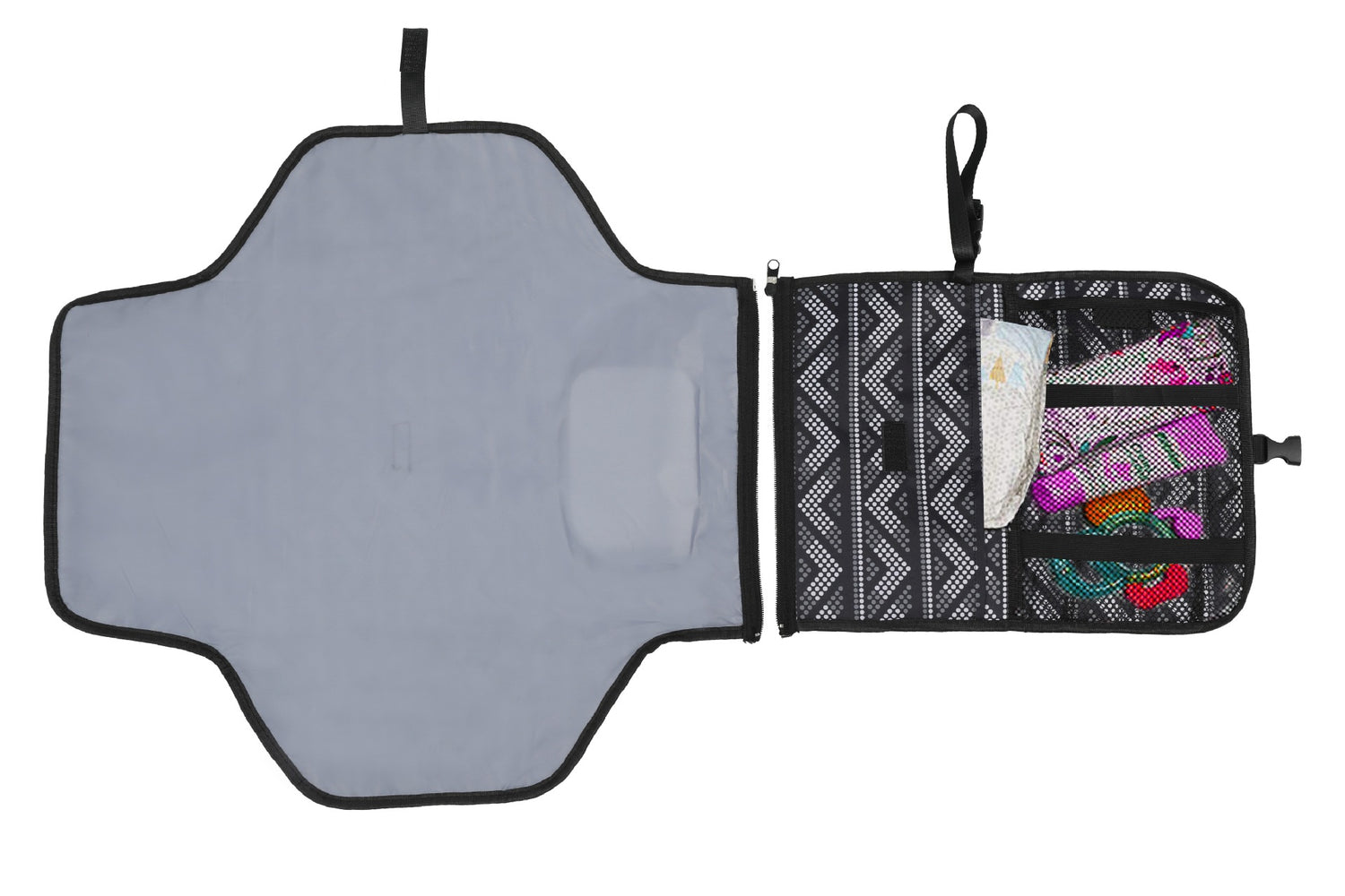 Gray changing mat with black trim, attached black pouch with mesh pockets, visible diapers and items.
