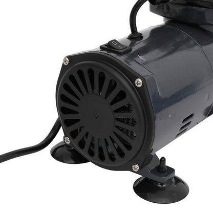 Dark gray cylindrical motor with a vented front, power switch, and suction cup feet on a white background.