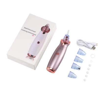 Pink and rose gold cleaning device, box, USB cable, and blue nozzle attachments on white background.