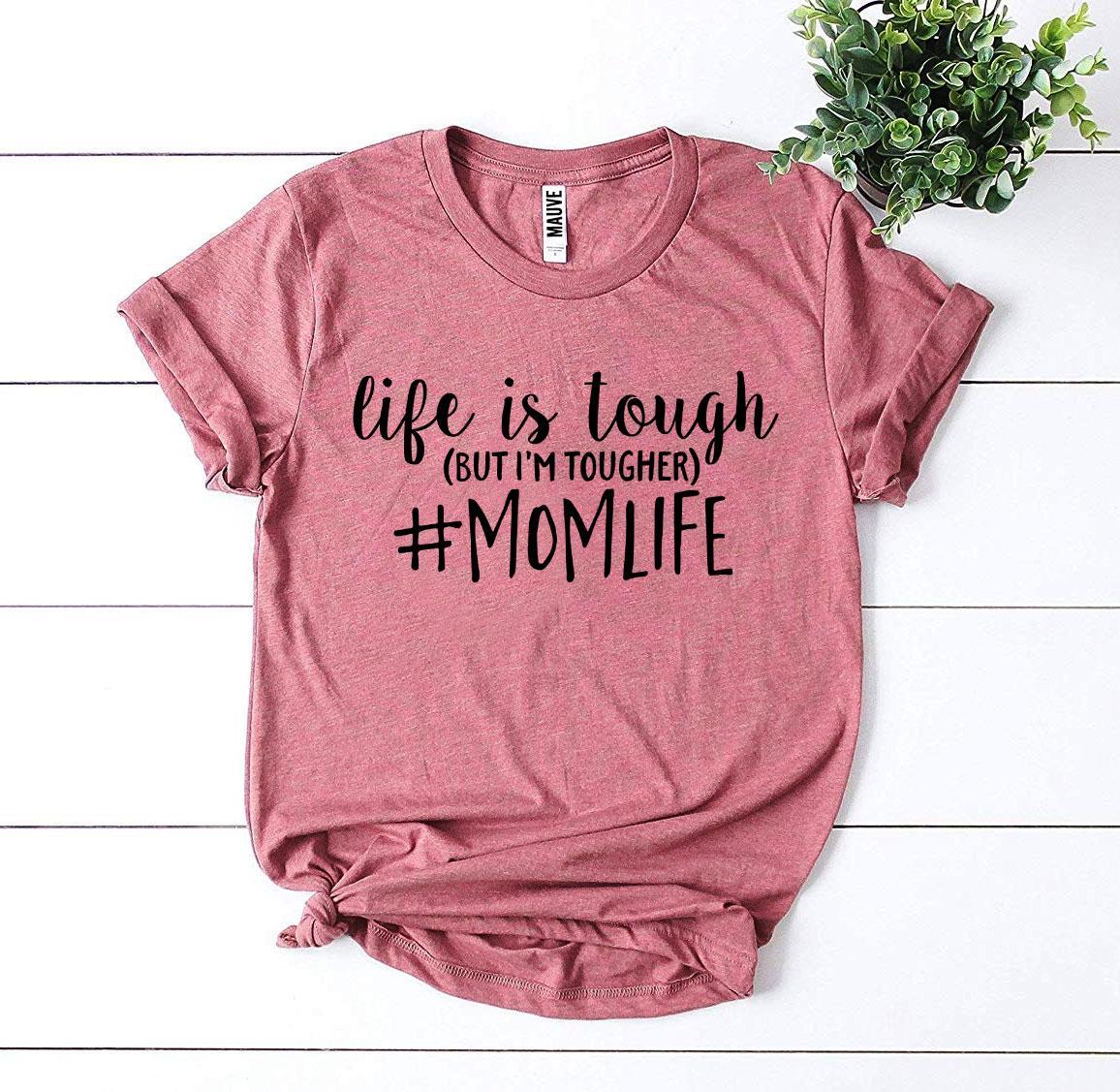Pink T-shirt with black text "Life is tough (but I&