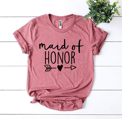 Pink t-shirt with "maid of honor" in black letters, arrow and heart design, against a white background.