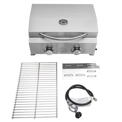 Silver tabletop gas grill with two knobs, a thermometer, a grill grate, drip tray, and a hose.