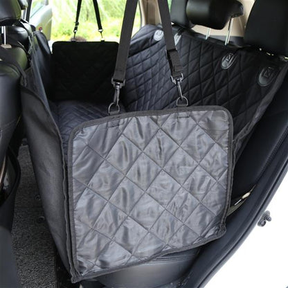 Quilted black dog car seat cover with straps in a vehicle&