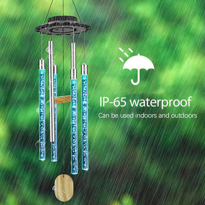 Wind chimes with blue LED lights in rain, labeled "IP-65 waterproof" on a green background.
