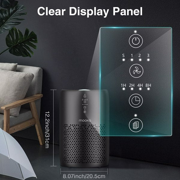 Black air purifier with touch panel and icons, next to a gray chair and potted plant.