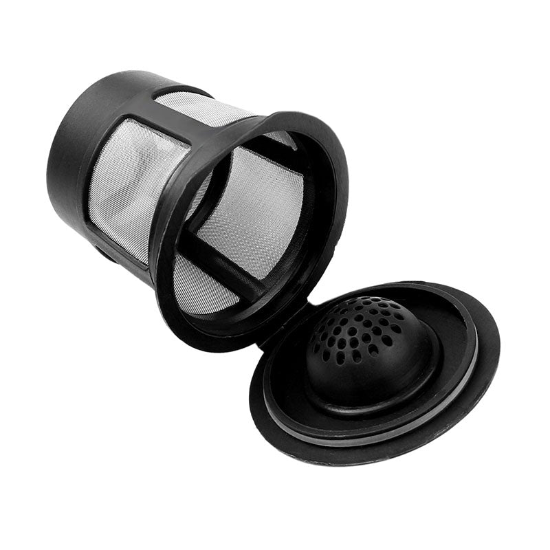 Black mesh coffee filter with perforated lid, tilted on its side, isolated on a white background.