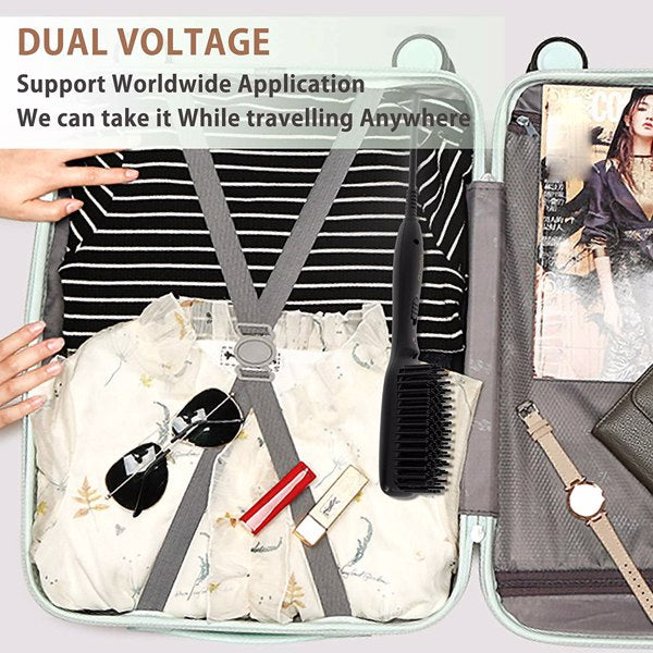 Open suitcase with clothes, sunglasses, makeup, a black brush, and a watch. Text: "Dual Voltage."