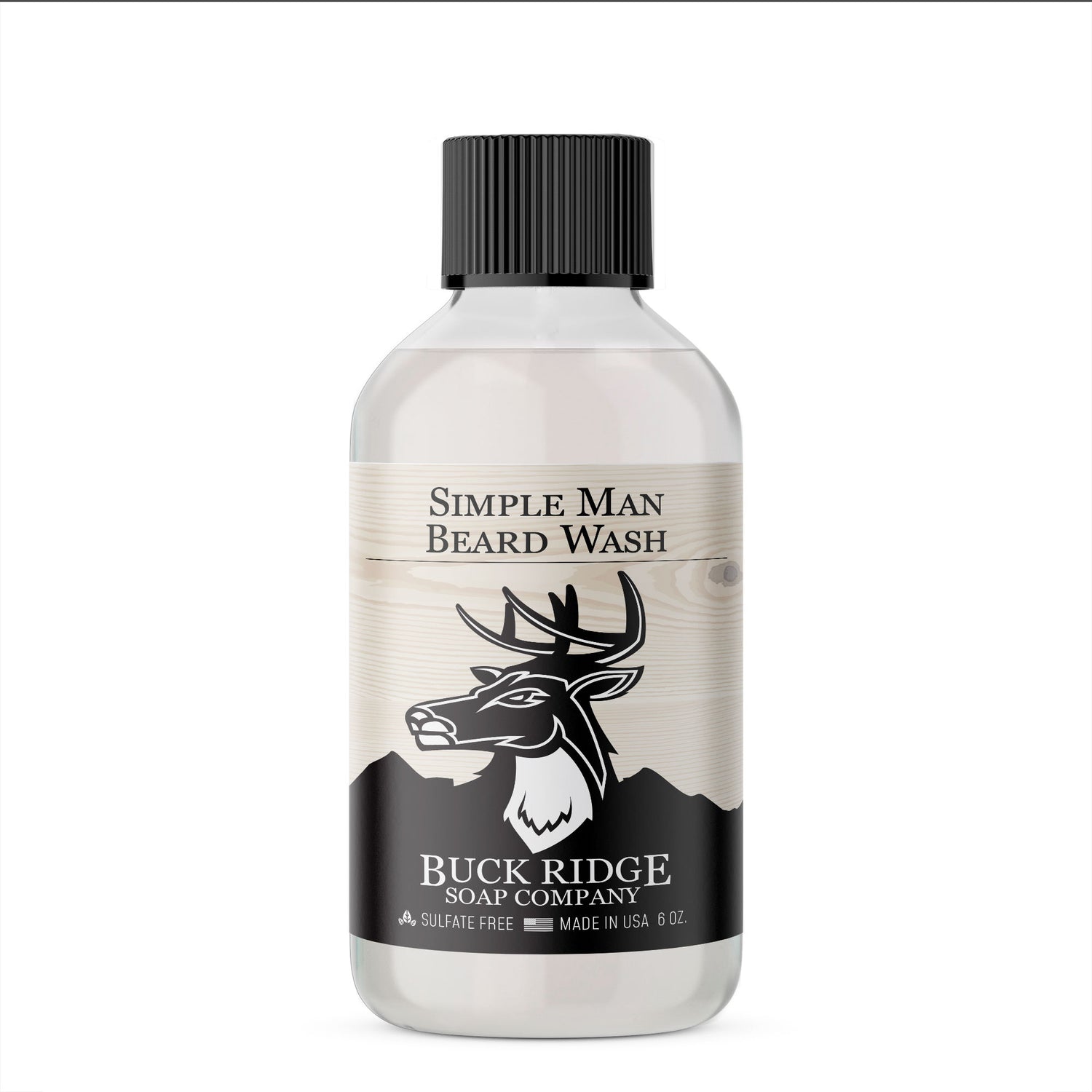 Clear bottle of beard wash with a black label, deer logo, black cap, and rustic wood design.