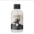 Clear bottle of beard wash with a black label, deer logo, black cap, and rustic wood design.