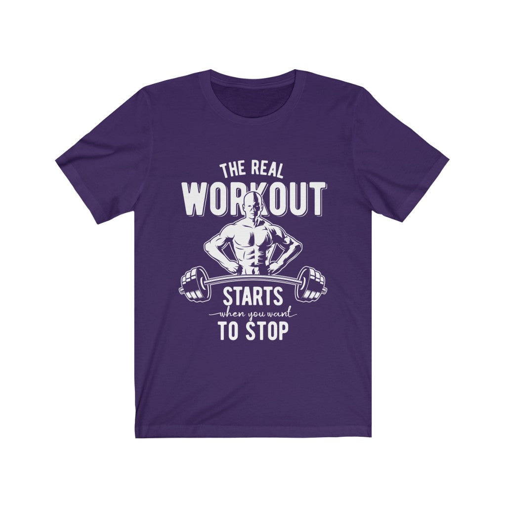 Purple t-shirt with a muscular figure and barbell graphic, reads "The real workout starts when you want to stop."