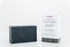 Dark gray rectangular soap bar beside white box labeled "Premium Coffee Soap."