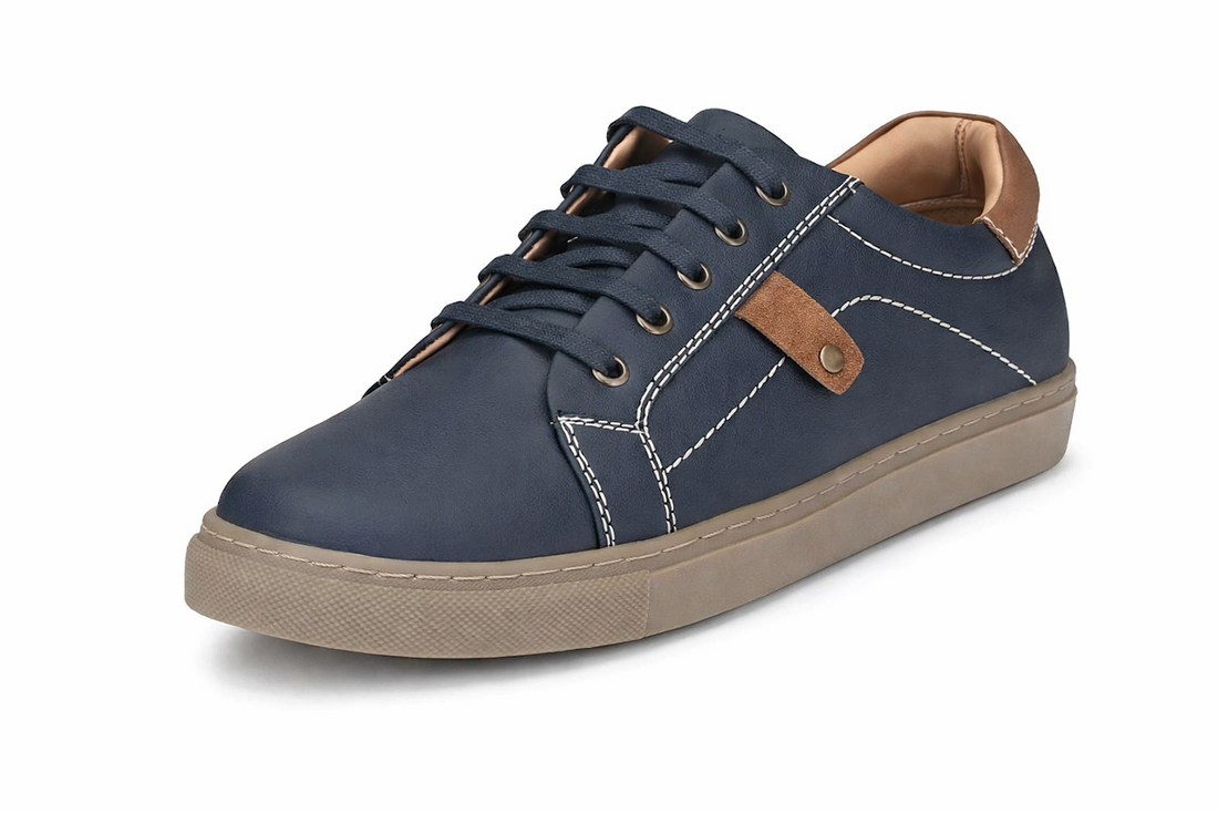 Navy blue sneaker with white stitching, brown accents, and beige sole.