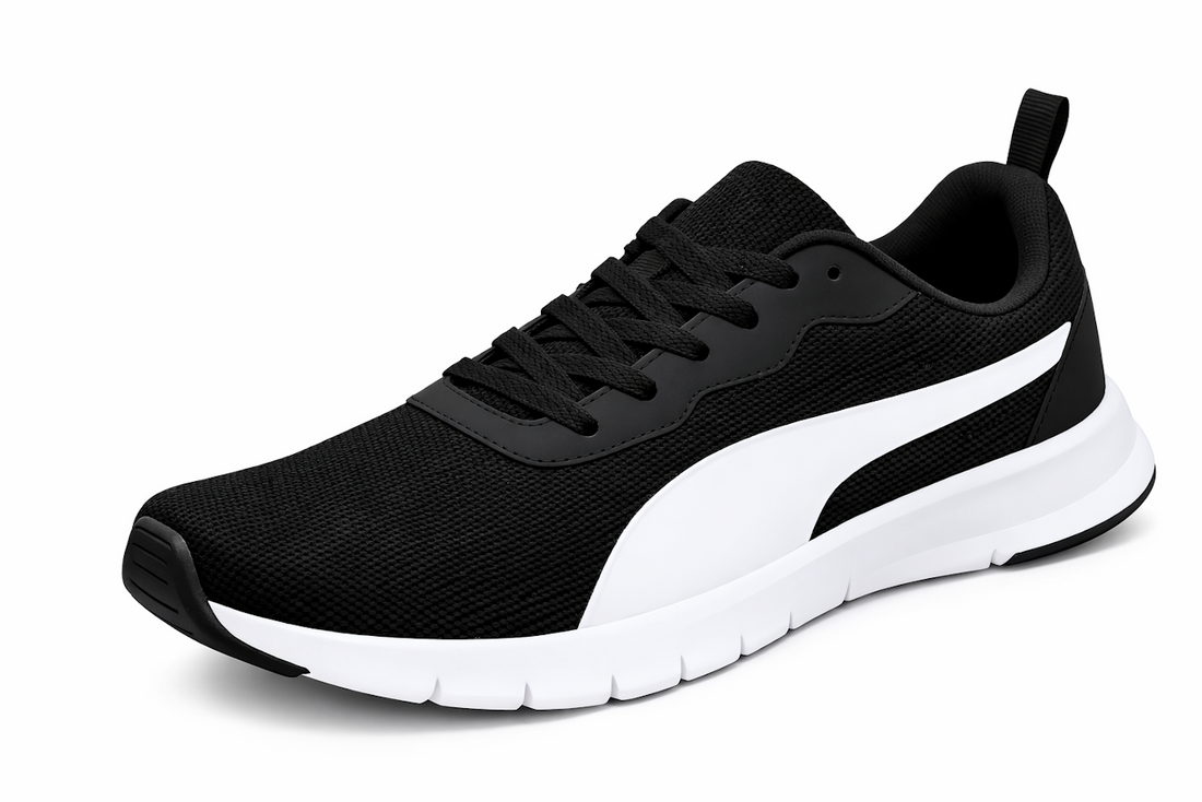 Black athletic shoe with white sole and stripe, featuring a woven texture and black laces.
