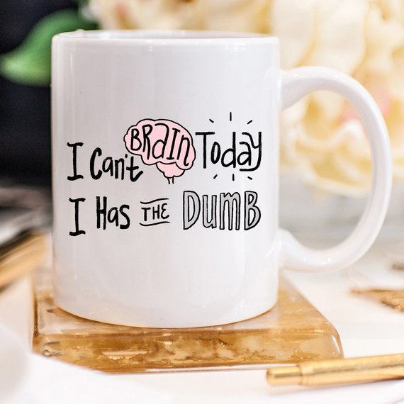 White mug with black text: "I can&