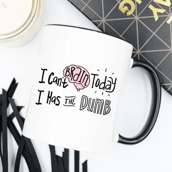 White mug with black handle, illustrated brain and text: "I Can&