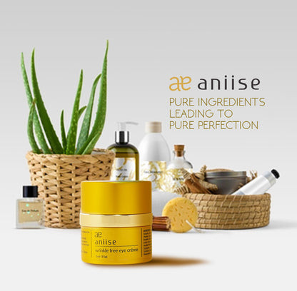 Yellow eye cream jar with aloe plant and skincare bottles in woven baskets on a white background.