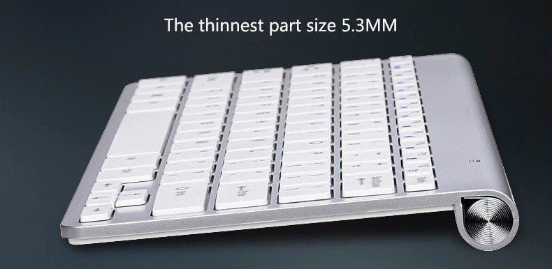 Sleek silver keyboard with white keys, thin design, and rolled base. Text: "Thinnest part size 5.3MM".