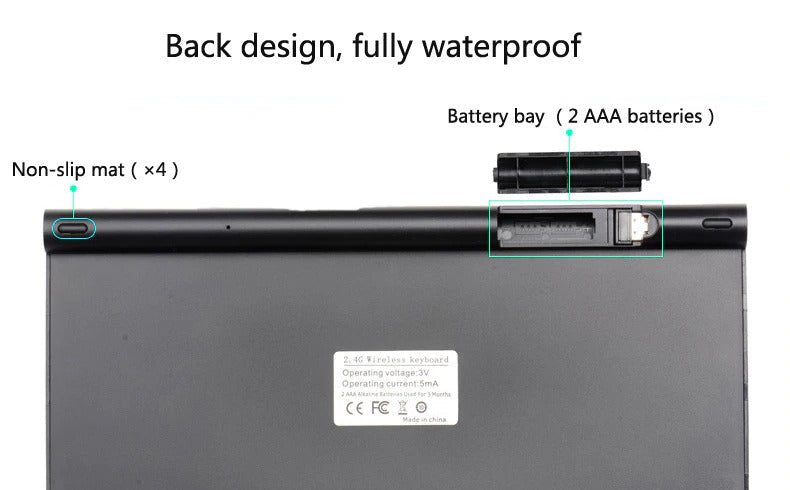 Black keyboard back with a battery bay for 2 AAA batteries and non-slip mats, labeled waterproof.