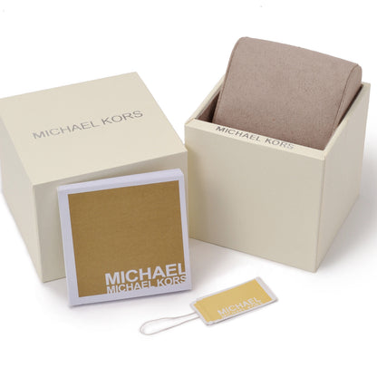 Beige Michael Kors box with cushion inside, beside tag and card on white background.