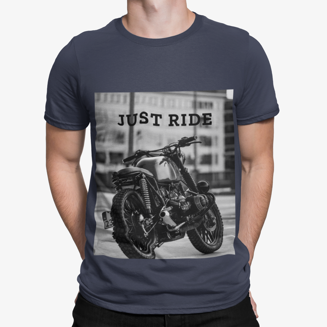 Man in navy T-shirt with black-and-white motorcycle print and "JUST RIDE" text.