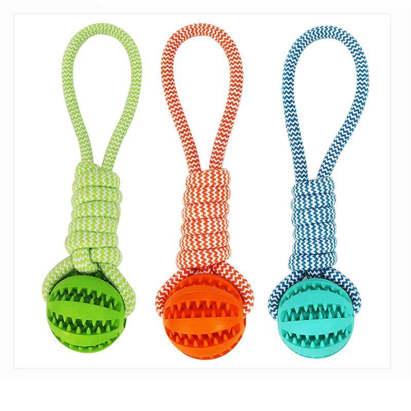 Three colorful rope dog toys: green, orange, and blue, each with a rubber ball and textured patterns.