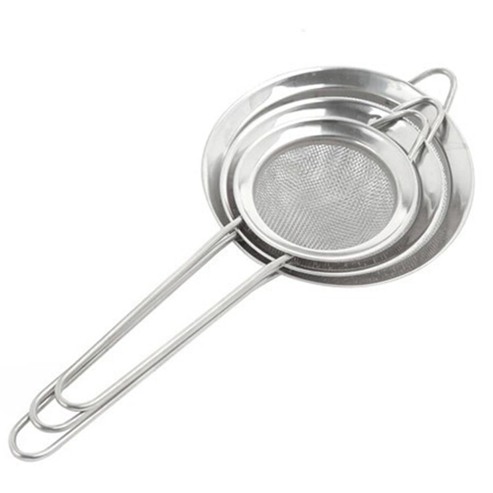 Three nested stainless steel sieves with mesh centers and long handles.