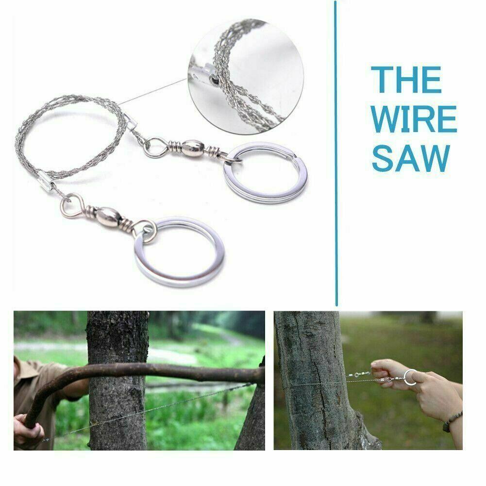 Wire saw with metal loops cuts tree branches in forest setting.