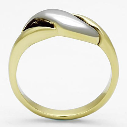 Gold ring with a sleek, curved silver accent on top against a white background.