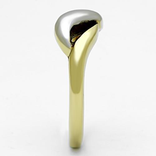 Gold ring with a smooth, curved design and a white metallic accent on top, against a white background.