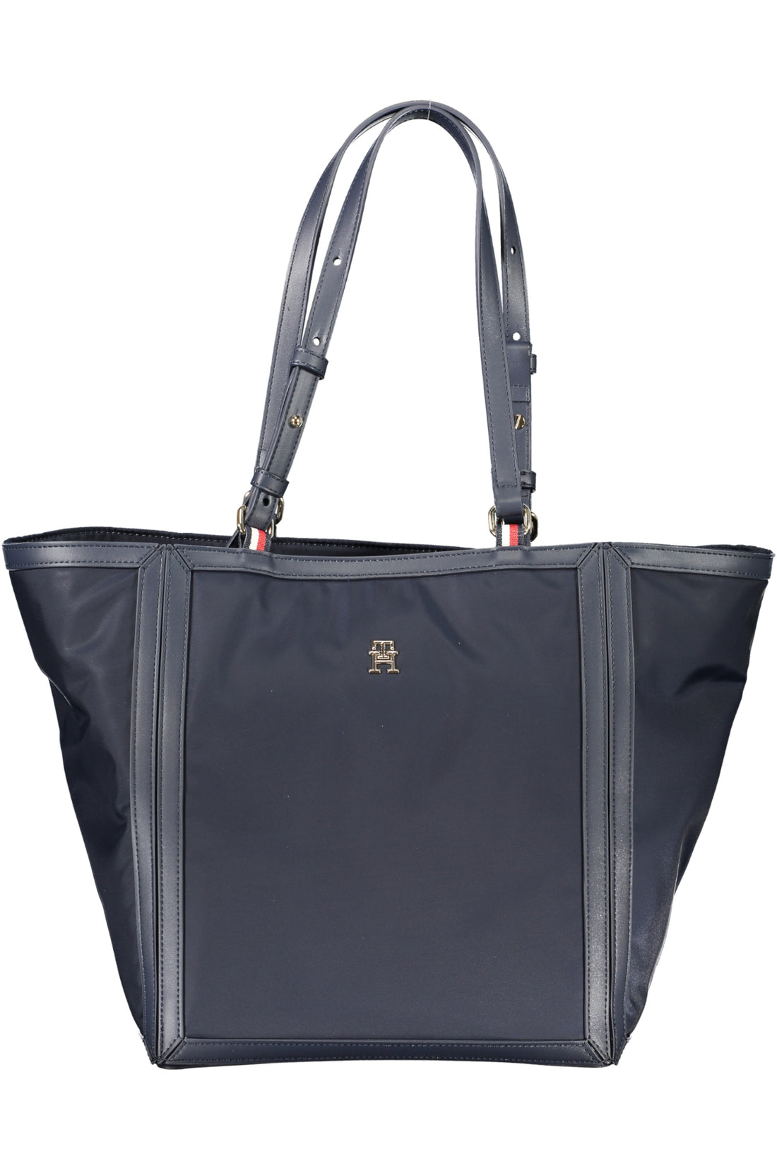 Dark blue tote bag with adjustable straps, stitched edges, and a small gold logo on the front.