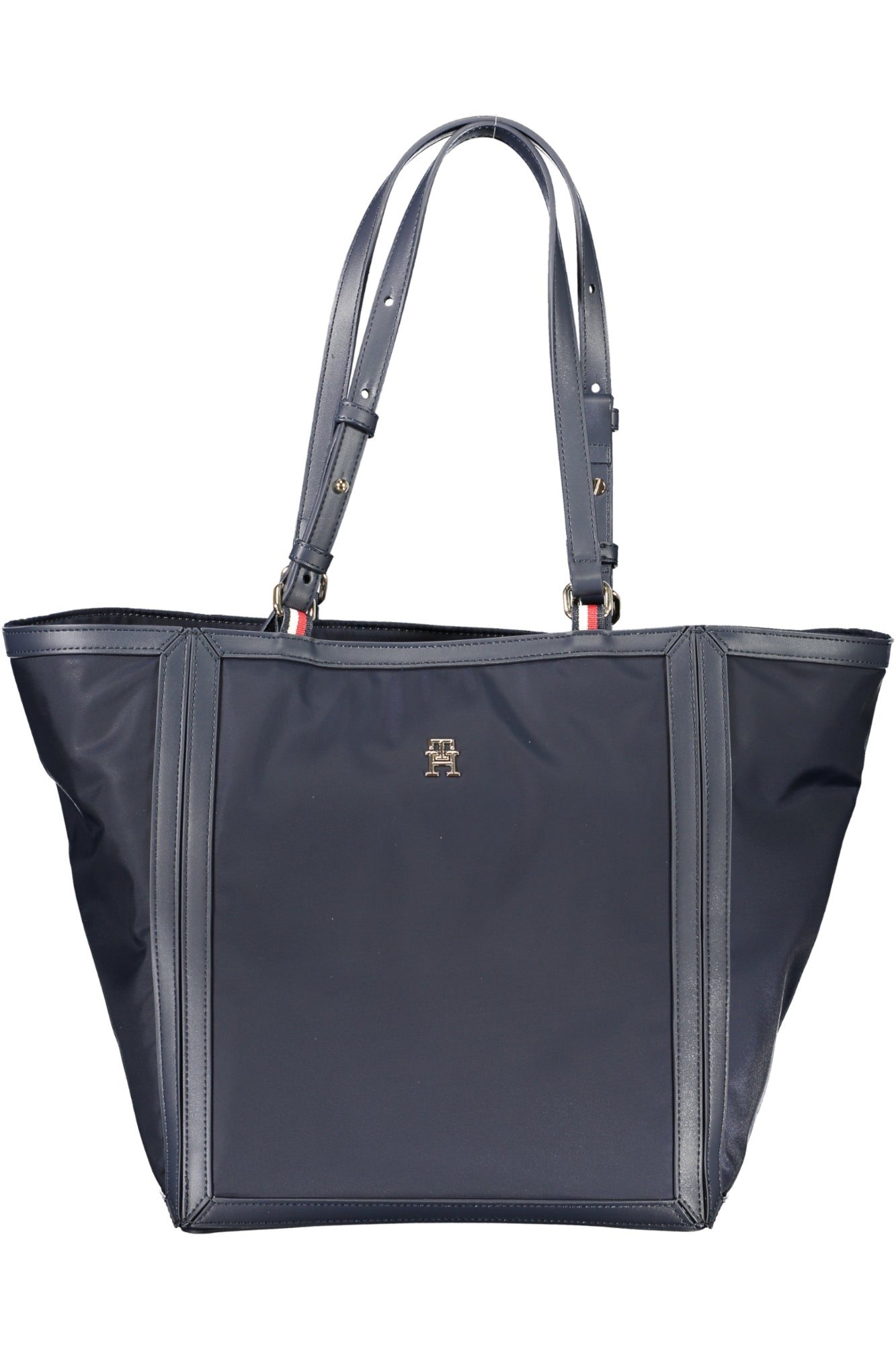 Dark blue tote bag with adjustable straps, stitched edges, and a small gold logo on the front.