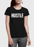 Woman in a black T-shirt with "HUSTLE" in bold white text, paired with gray pants.